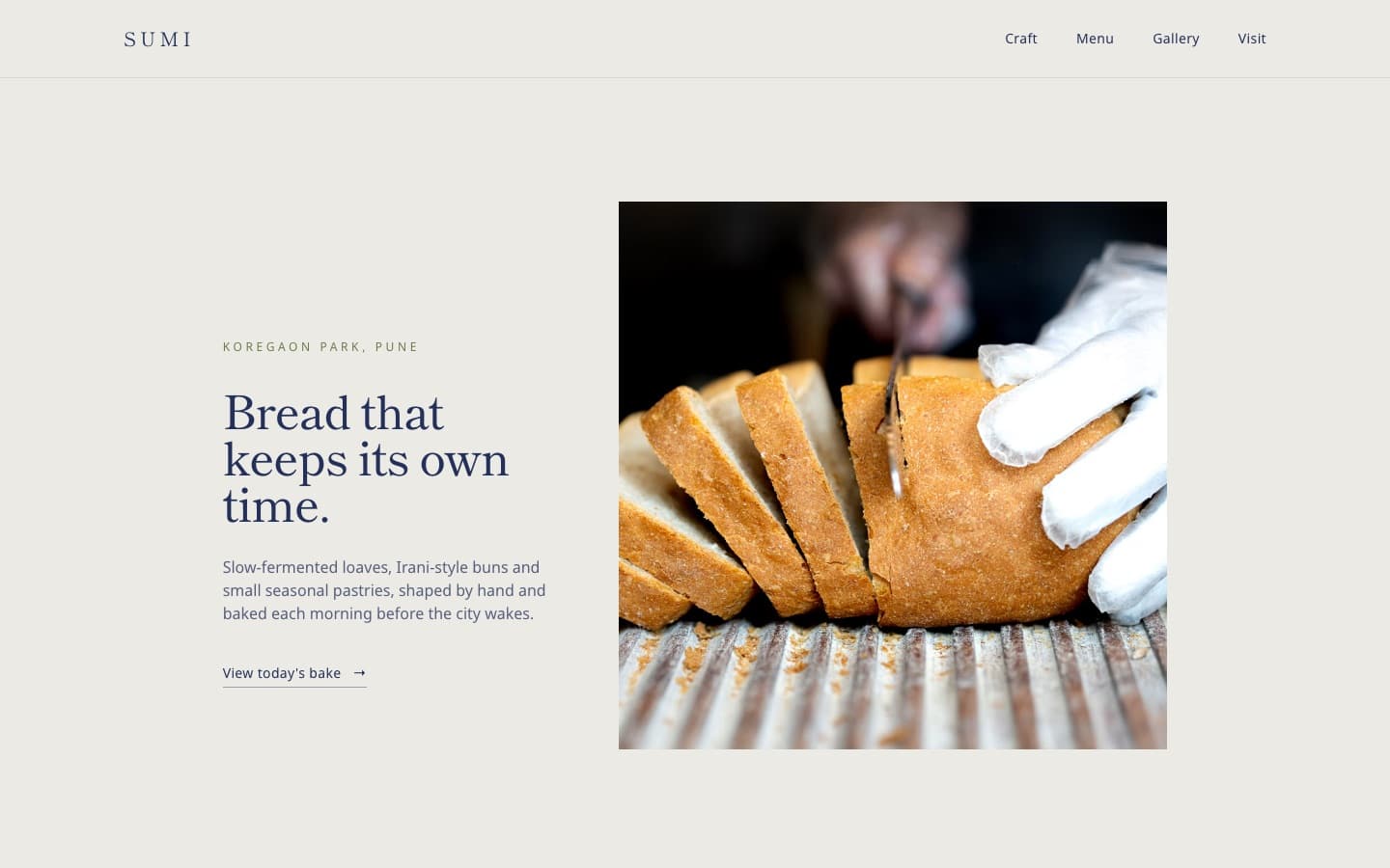Sumi Bakehouse website: a quiet serif headline on stone grey beside a square photo of bread being sliced